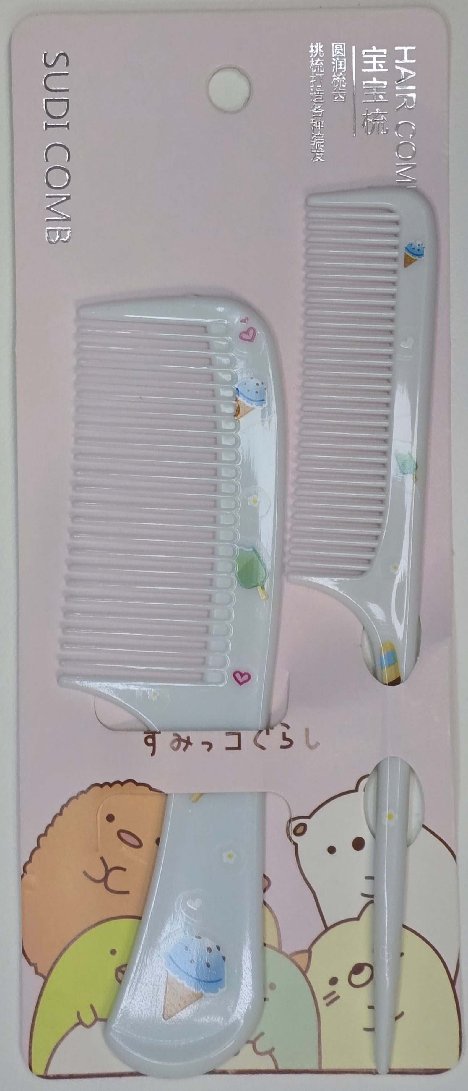 Set of hair combs with a cute design on a white background
