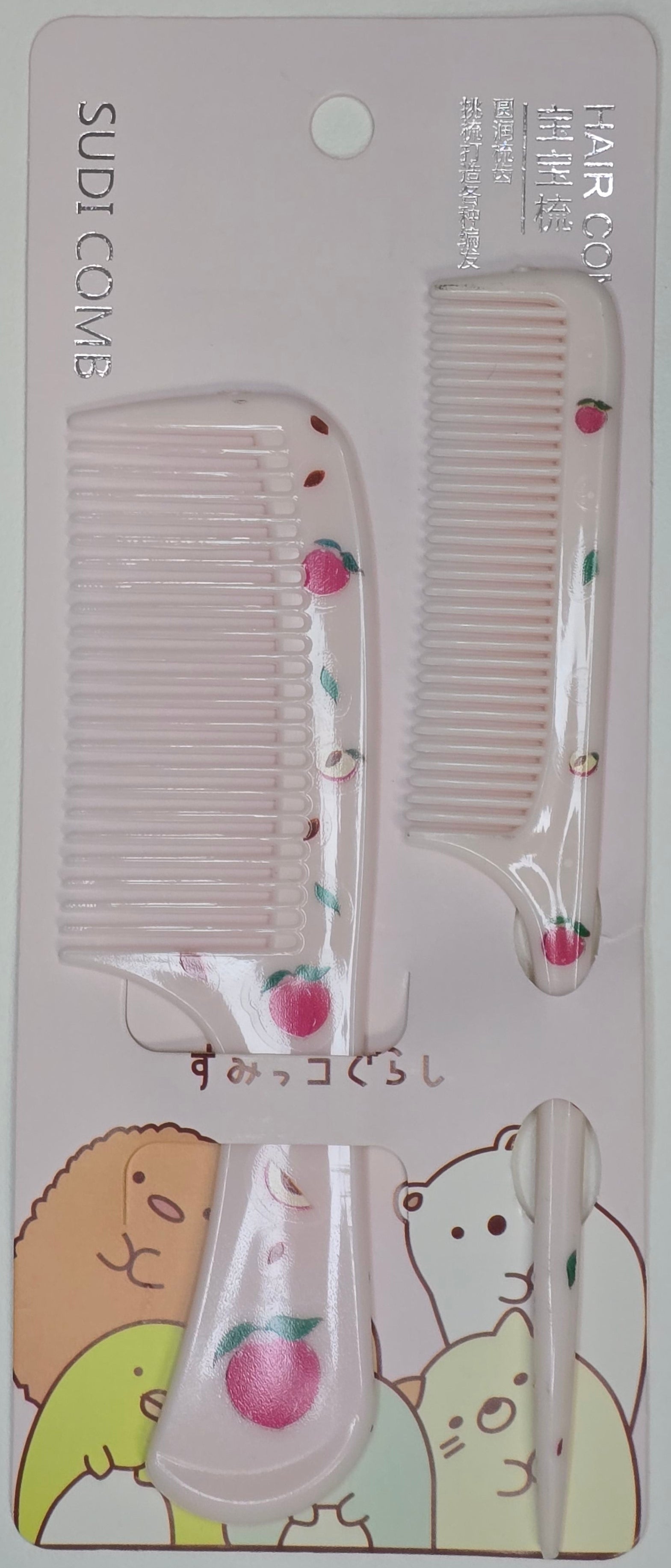 Set of hair combs and clips with peachdesigns on a white background